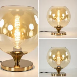 Elegante tafellamp donker goud met amber glazen bol 25 cm><noscript><img width=